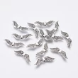 Kép 3/3 - Antikolt ezüst színű angyalszárny köztes (23x7mm)/5db