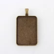 Kép 1/2 - Bronz színű téglalap alakú medálalap (33x23mm)
