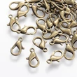 Kép 1/6 - 10db Antikolt bronz színű delfinkapocs (14x8mm)