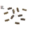 Kép 2/4 - 10db antikolt bronz színű szalagvégzáró (16mm)