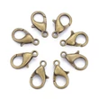Kép 2/6 - 10db Antikolt bronz színű delfinkapocs (14x8mm)