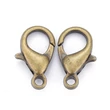 Kép 4/6 - 10db Antikolt bronz színű delfinkapocs (14x8mm)