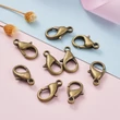 Kép 5/6 - 10db Antikolt bronz színű delfinkapocs (14x8mm)