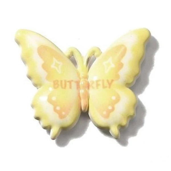 Sárga pillangó műgyanta kaboson  (37x31x5mm)