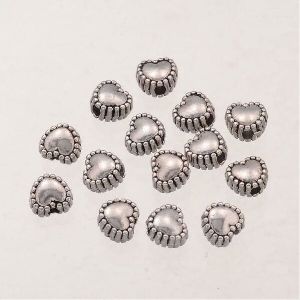10db antikolt ezüst színű szív alakú köztes gyöngy (5,5mm)