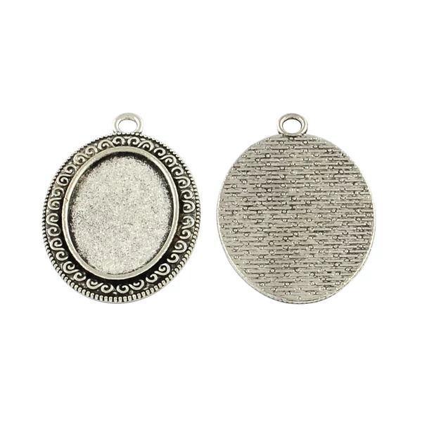 Antikolt ezüst színű csigavonalas medálalap (18x25mm)
