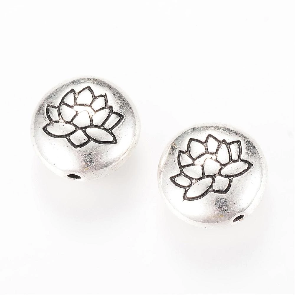 Antikolt ezüst színű lótusz mintás lapított gyöngy (14x6,5mm)